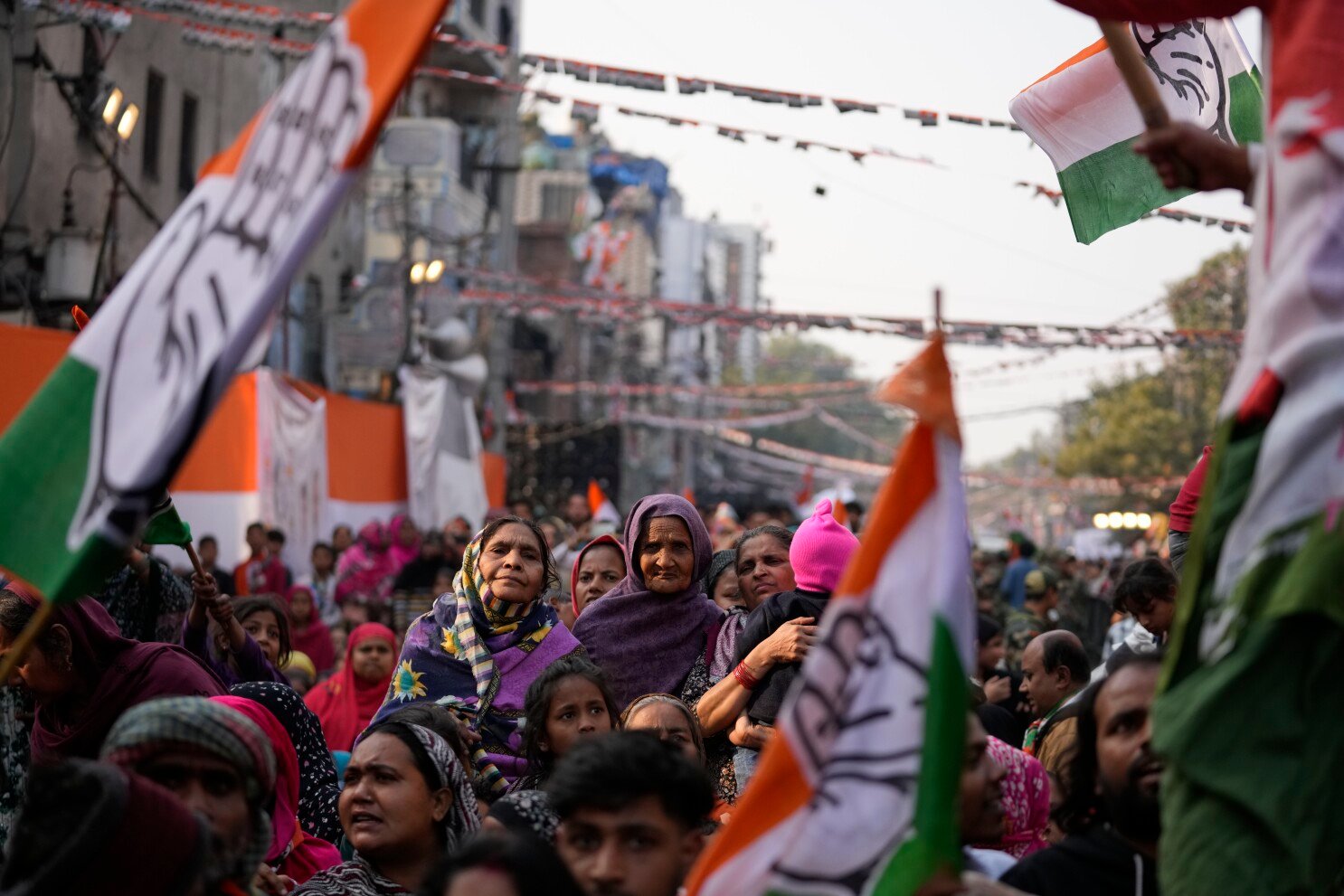 A BJP supporter wears a mask of Indian Prime Minister Narendra Modi during a Delhi state election campaign rally in New Delhi, India, on Friday, January 31, 2025 [AP Photo]